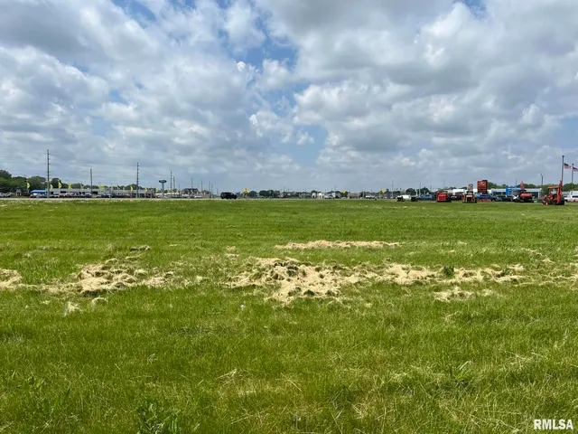 a view of a big yard with lots of green space