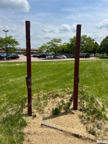 a view of a garden with a pole