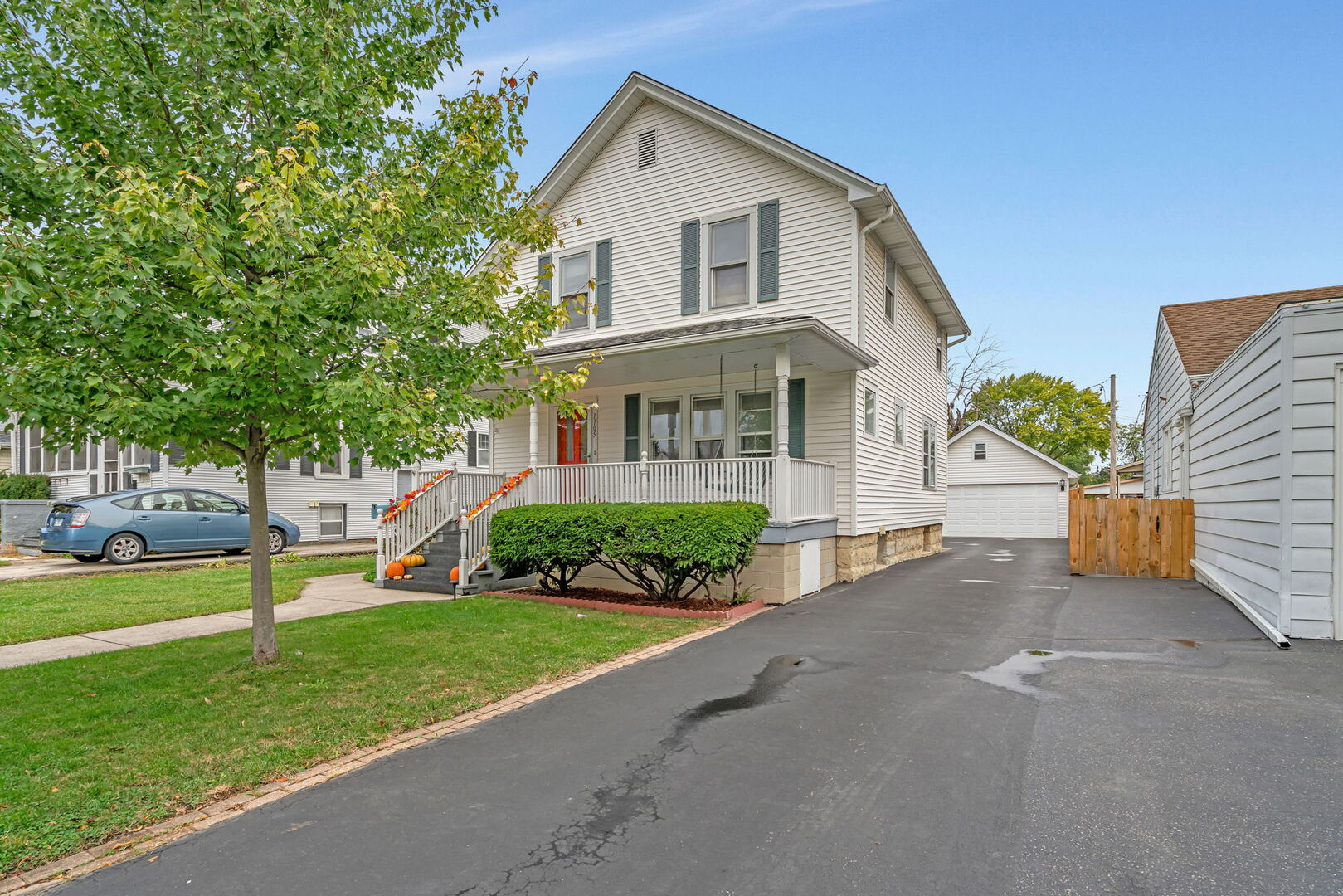 1105 Taylor Street Joliet, IL 60435 - Photo 2 of 24 a front view of a house with a yard and trees