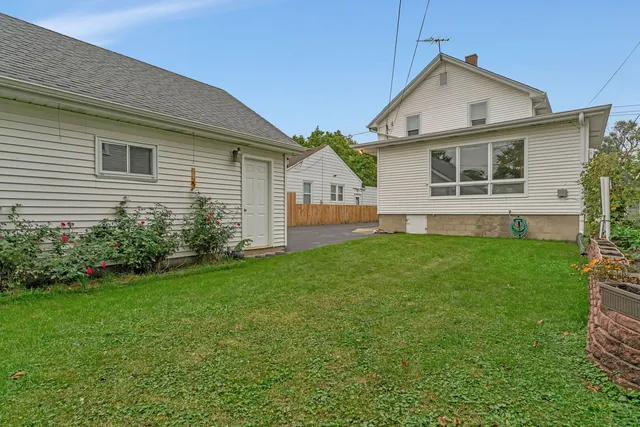 a view of a house with a yard