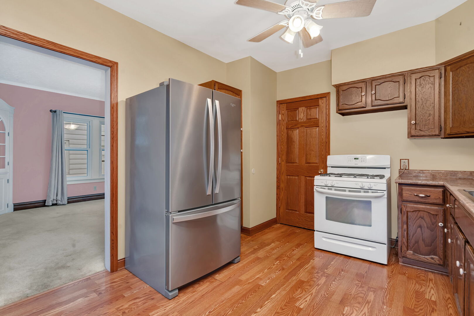 1105 Taylor Street Joliet, IL 60435 - Photo 9 of 24 a kitchen with stainless steel appliances a refrigerator and a stove top oven