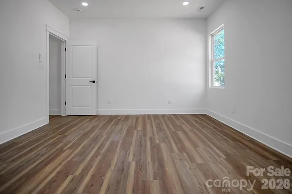 a white bath tub sitting next to a shower
