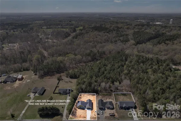 an aerial view of a house with swimming pool