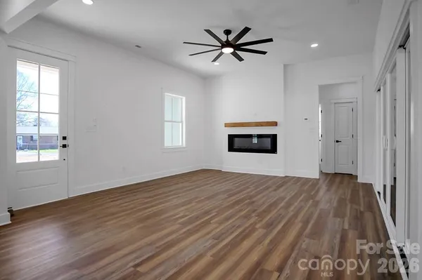 a view of kitchen with sink and wooden floor