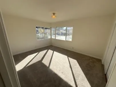 a view of an empty room and window