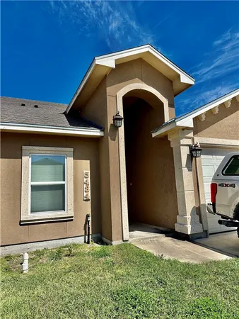 a front view of a house with garage