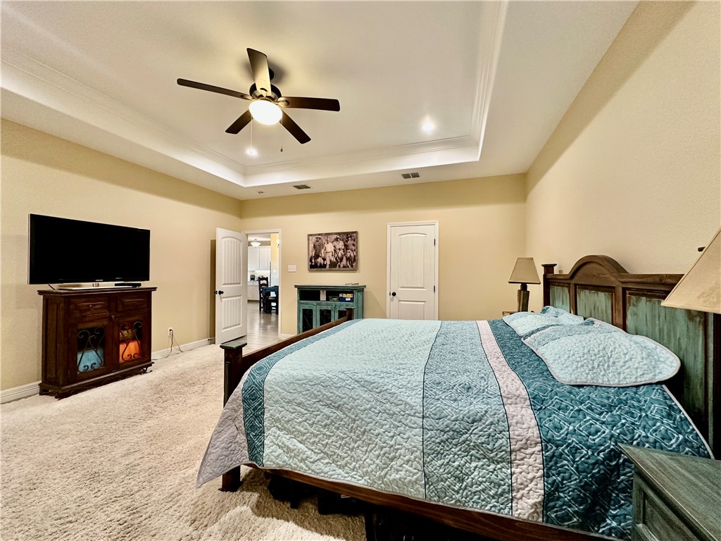 5434 Neela Corpus Christi, TX 78413 - Photo 16 of 31 a bedroom with a bed and a flat screen tv