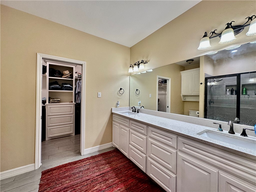 5434 Neela Corpus Christi, TX 78413 - Photo 18 of 31 a spacious bathroom with a double vanity sink and a mirror