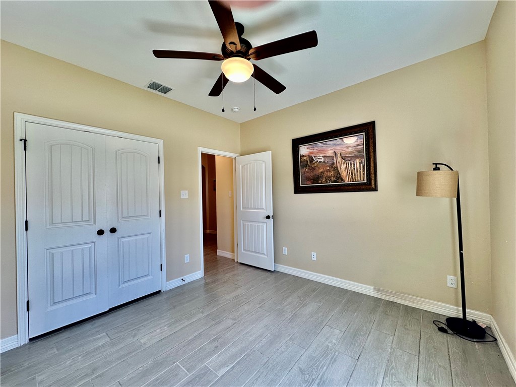 5434 Neela Corpus Christi, TX 78413 - Photo 23 of 31 a view of empty room with wooden floor