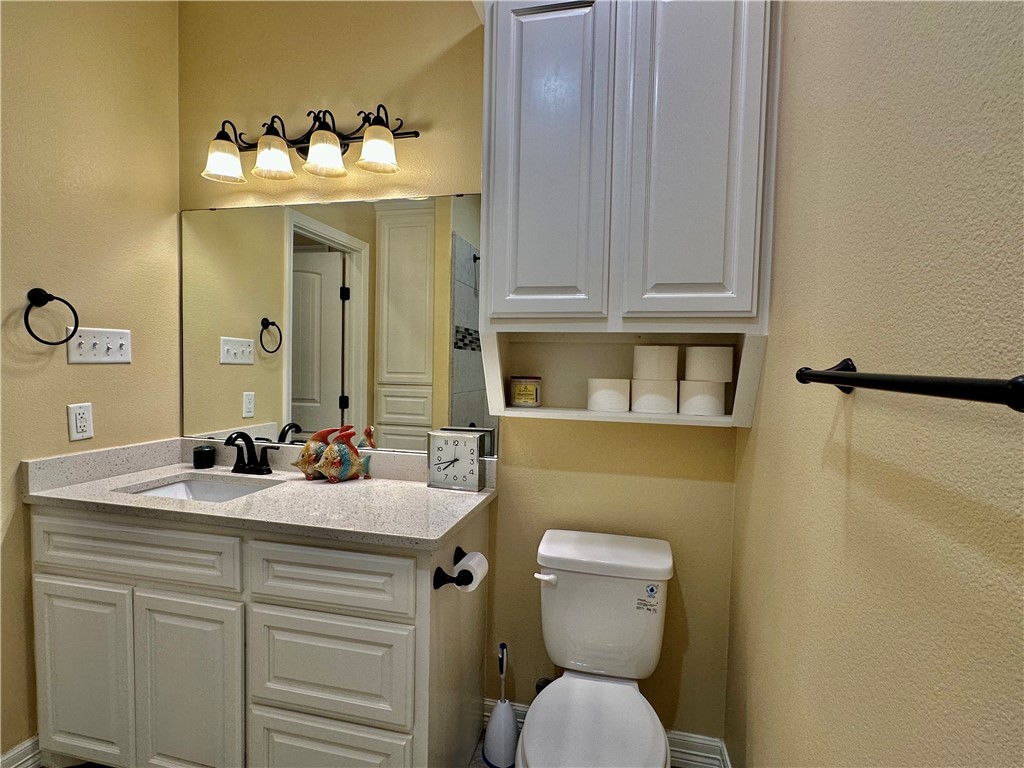 5434 Neela Corpus Christi, TX 78413 - Photo 24 of 31 a bathroom with a sink and a toilet