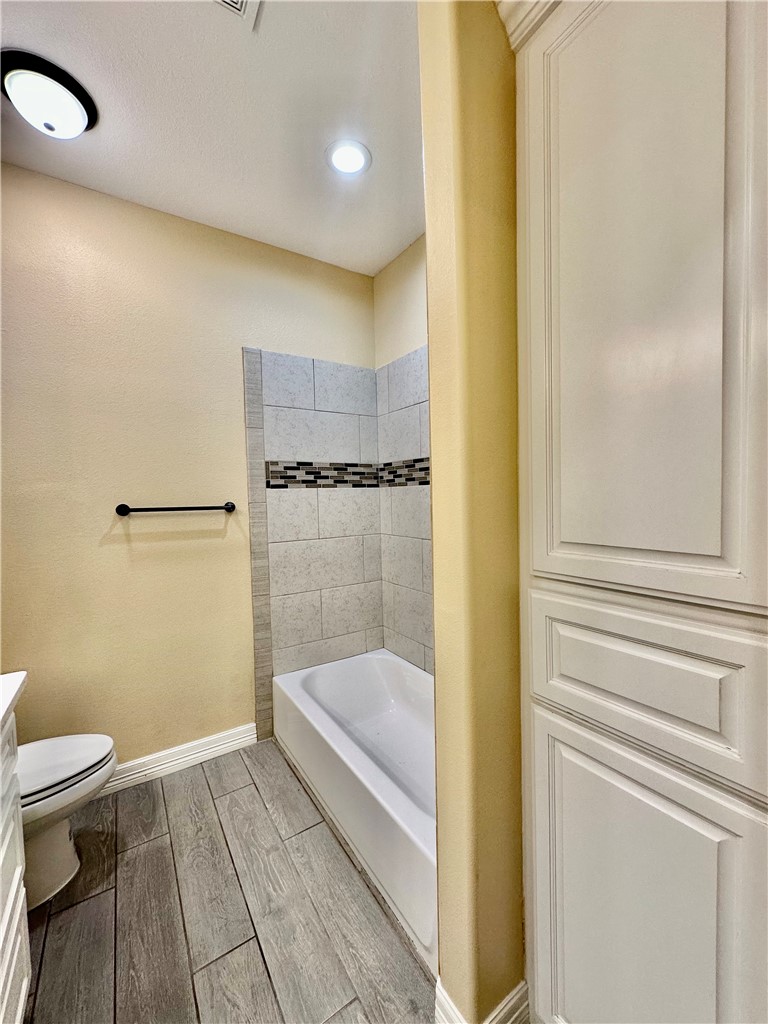 5434 Neela Corpus Christi, TX 78413 - Photo 26 of 31 a bathroom with a tub and toilet