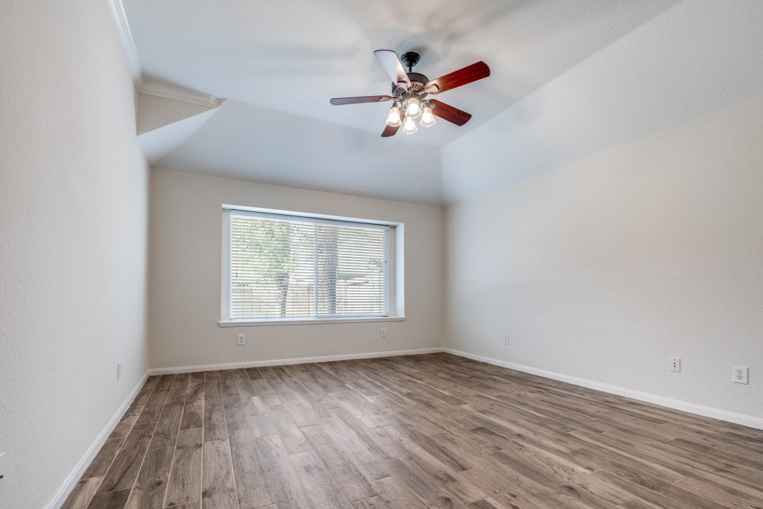 130 South Veranda Ridge Drive Spring, TX 77382 - Photo 11 of 23 wooden floor in an empty room with a window