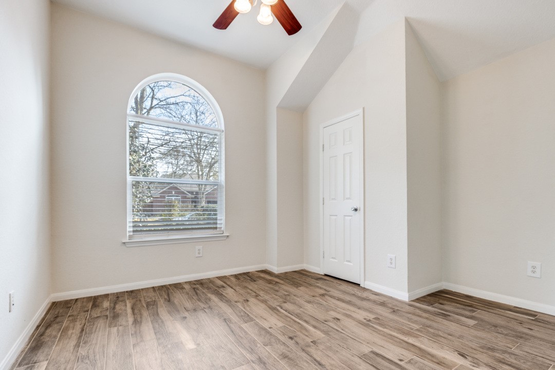 130 South Veranda Ridge Drive Spring, TX 77382 - Photo 16 of 23 an empty room with wooden floor closet and windows
