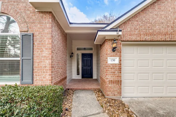 a view of a brick house with front door