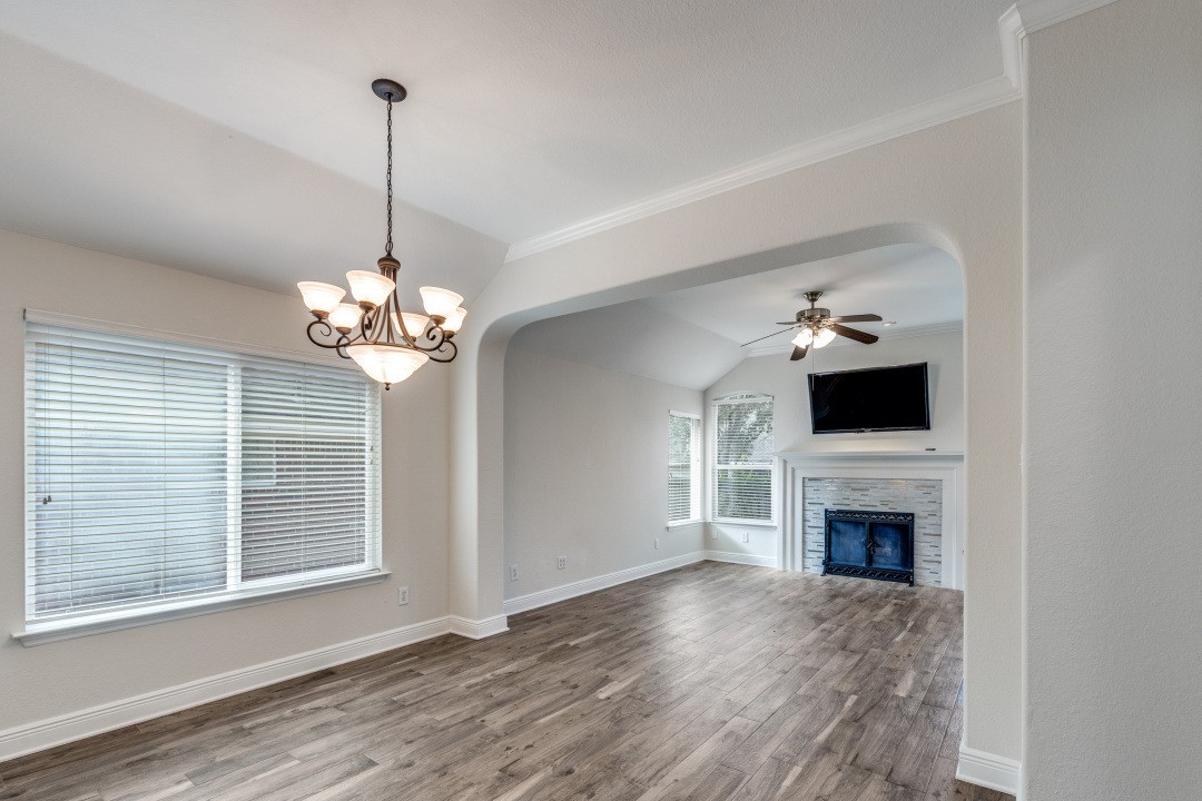 130 South Veranda Ridge Drive Spring, TX 77382 - Photo 4 of 23 a view of a livingroom with a furniture wooden floor fireplace and a window