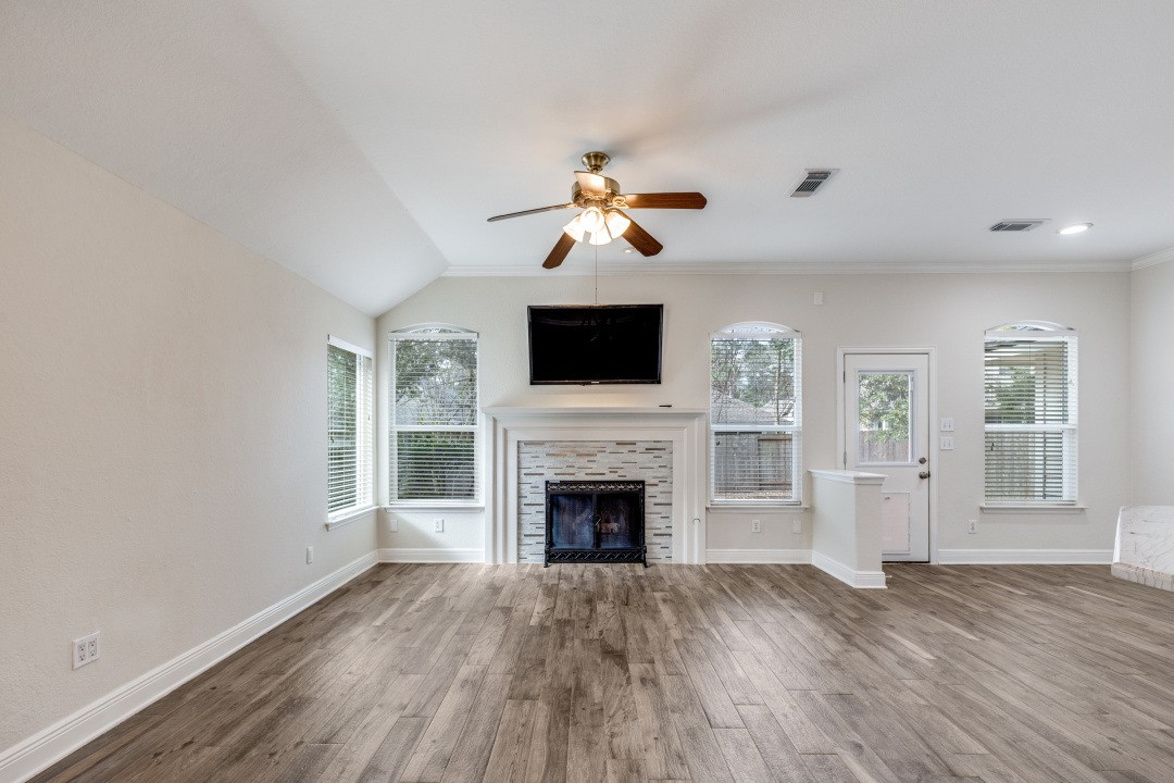 130 South Veranda Ridge Drive Spring, TX 77382 - Photo 5 of 23 a living room with fireplace furniture and a flat screen tv