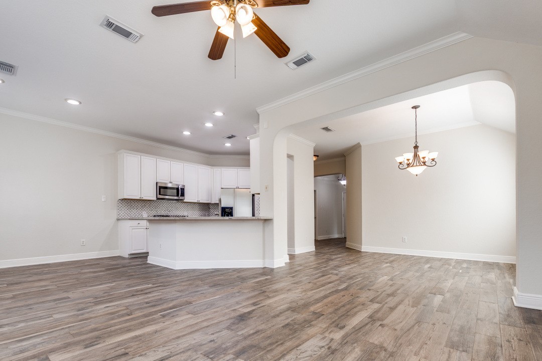 130 South Veranda Ridge Drive Spring, TX 77382 - Photo 6 of 23 a view of a kitchen and a chandelier fan