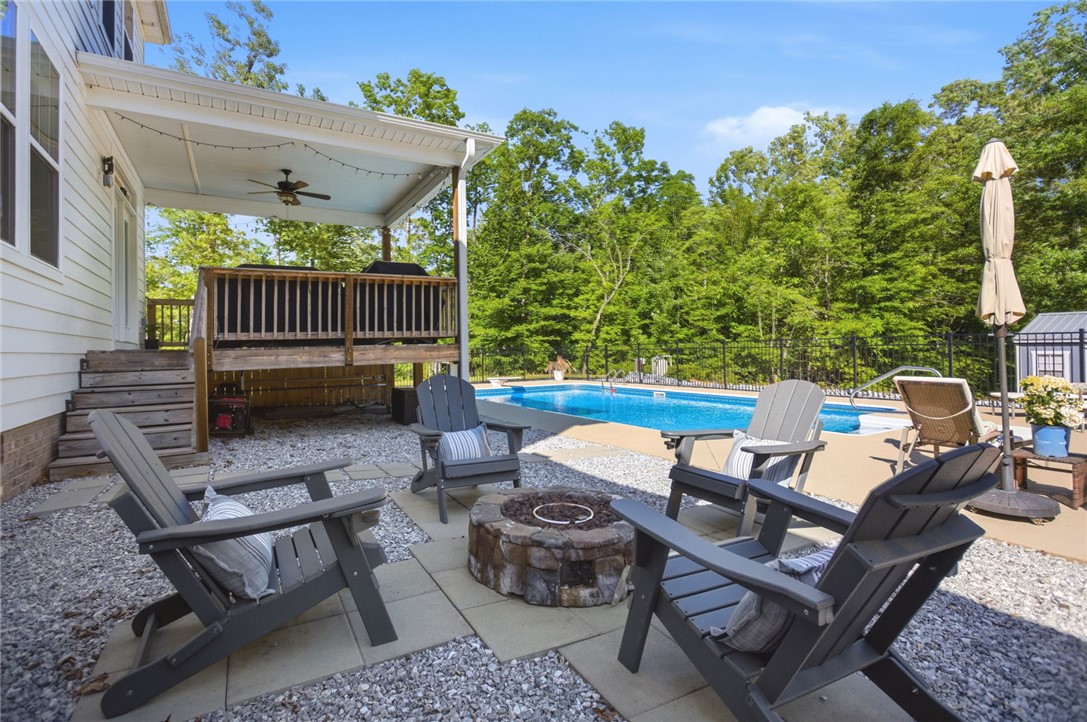 525 16th Circle Walhalla, SC 29691 - Photo 32 of 50 Relax in this serene outdoor oasis, complete with a private pool and cozy fire pit area.