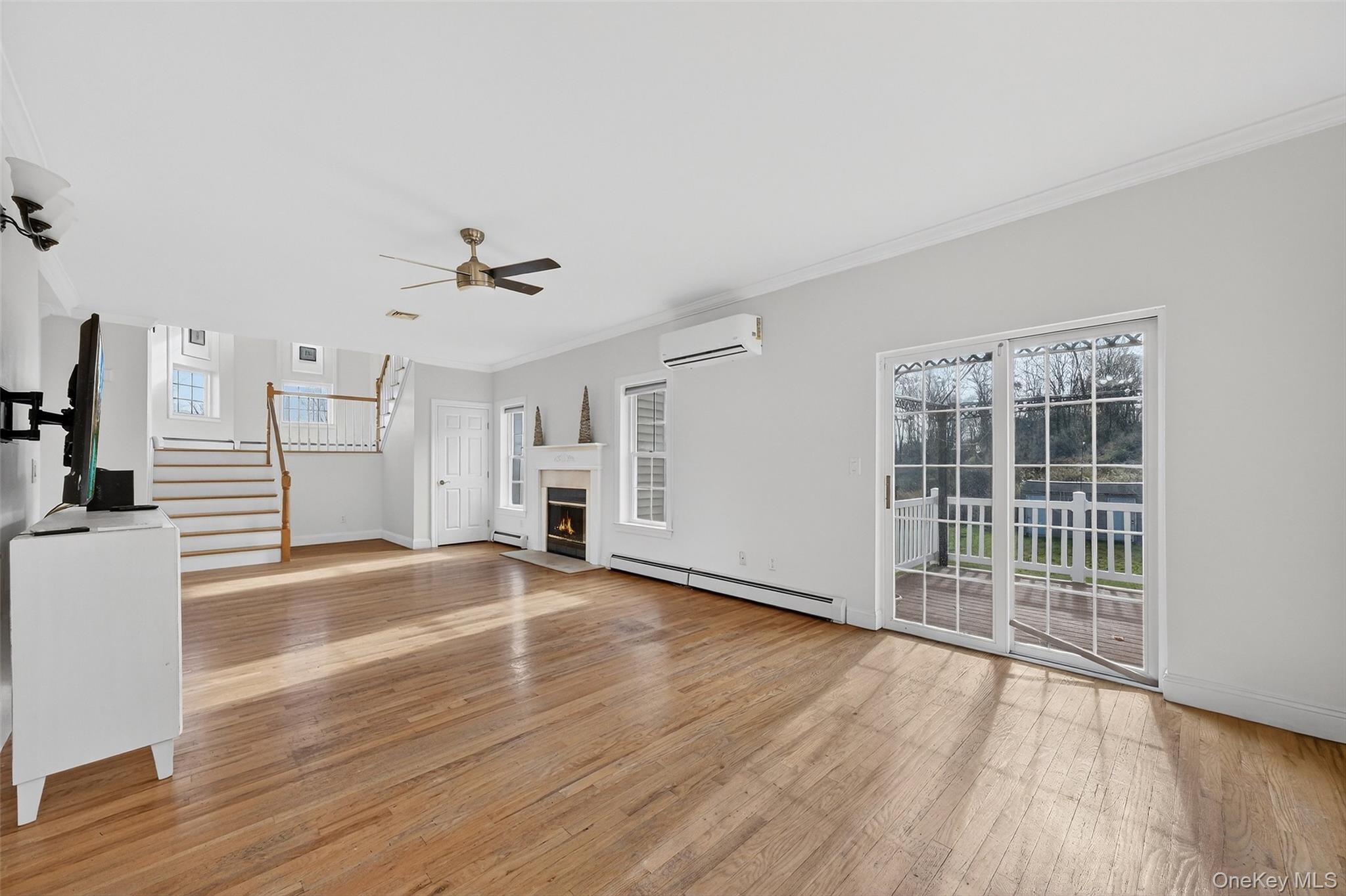 237 Lattintown Road Marlboro, NY 12542 - Photo 13 of 34 a view of empty room with wooden floor and fan