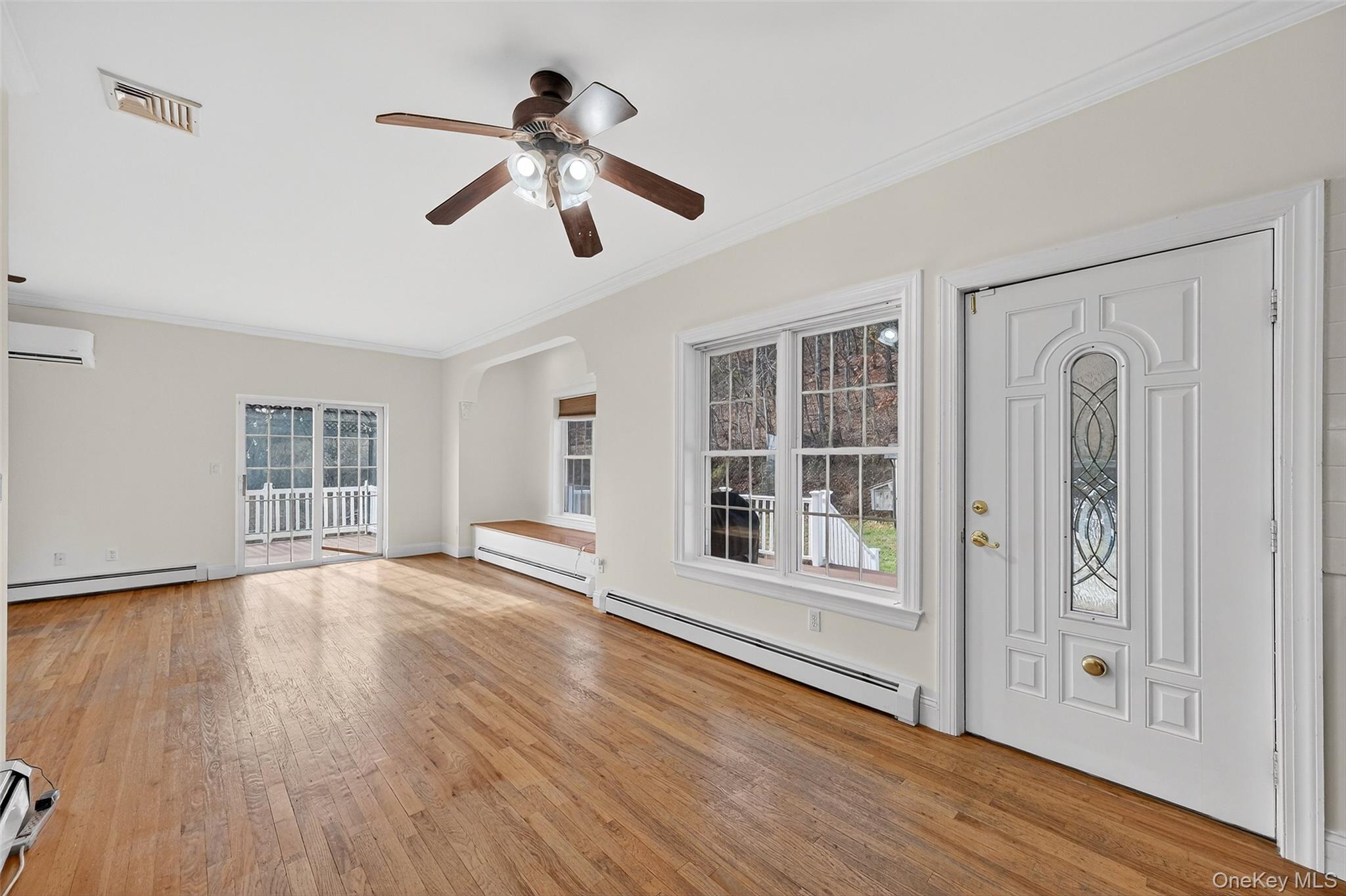 237 Lattintown Road Marlboro, NY 12542 - Photo 17 of 34 a view of empty room with wooden floor and window