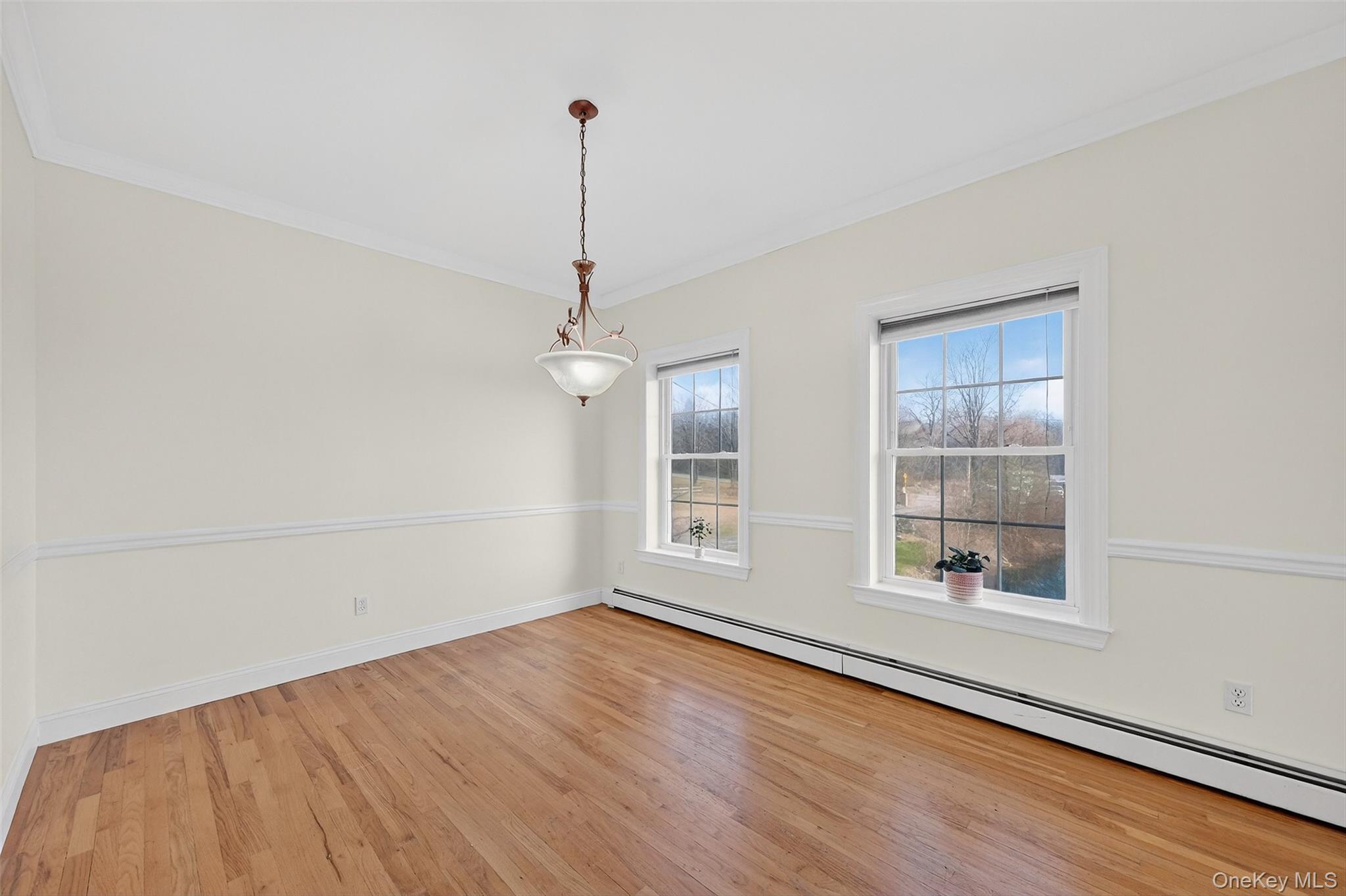 237 Lattintown Road Marlboro, NY 12542 - Photo 18 of 34 a view of an empty room with a window and wooden floor