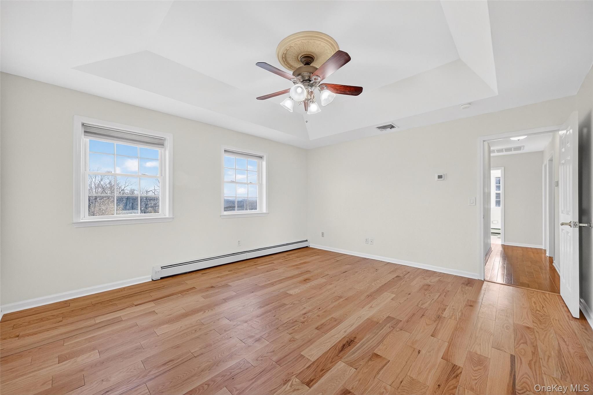 237 Lattintown Road Marlboro, NY 12542 - Photo 24 of 34 a view of an empty room with wooden floor and a window