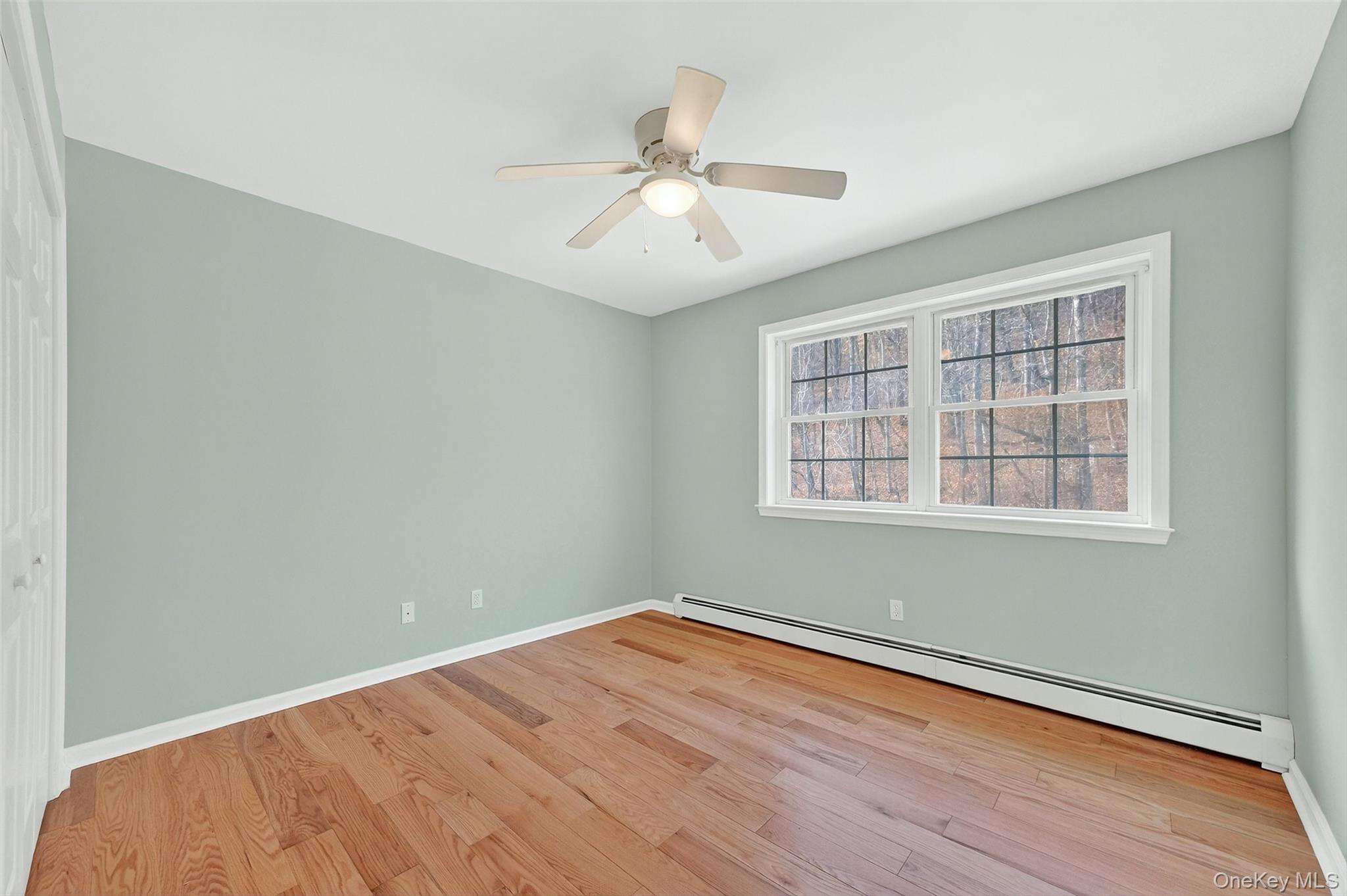 237 Lattintown Road Marlboro, NY 12542 - Photo 29 of 34 wooden floor in an empty room with a window