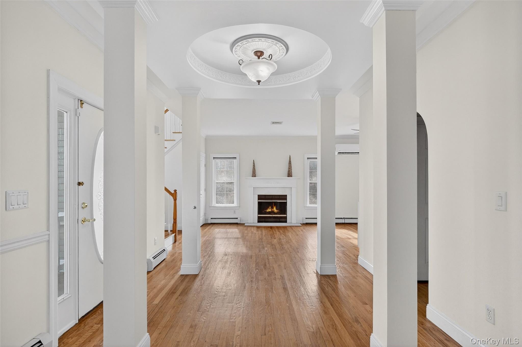 237 Lattintown Road Marlboro, NY 12542 - Photo 7 of 34 a view of a hallway with wooden floor and a fireplace