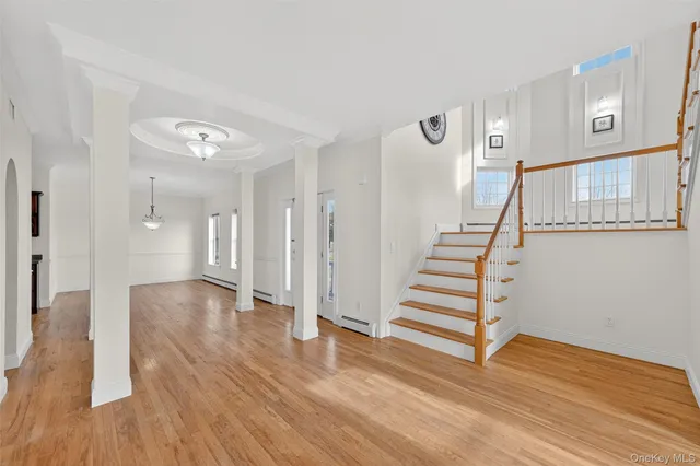 a view of entryway with wooden floor