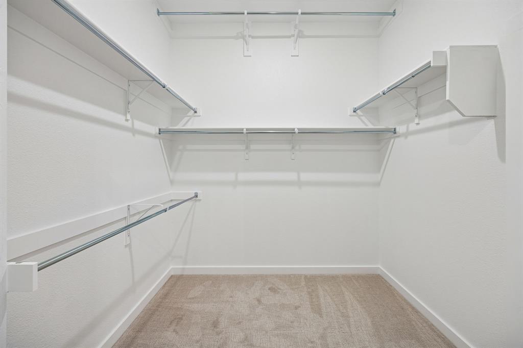 2121 Sunshining Road Princeton, TX 75407 - Photo 24 of 40 Primary Closet in the Gilmour II home plan by Trophy Signature Homes – REPRESENTATIVE PHOTO