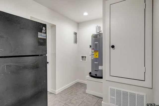 a kitchen with stainless steel appliances granite countertop a stove microwave and a sink