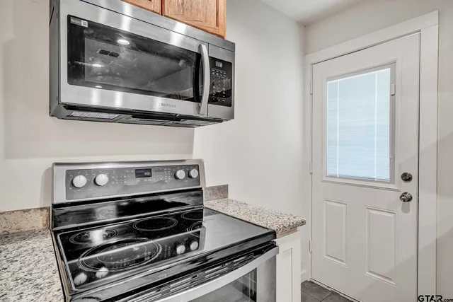 a kitchen with a sink and refrigerator