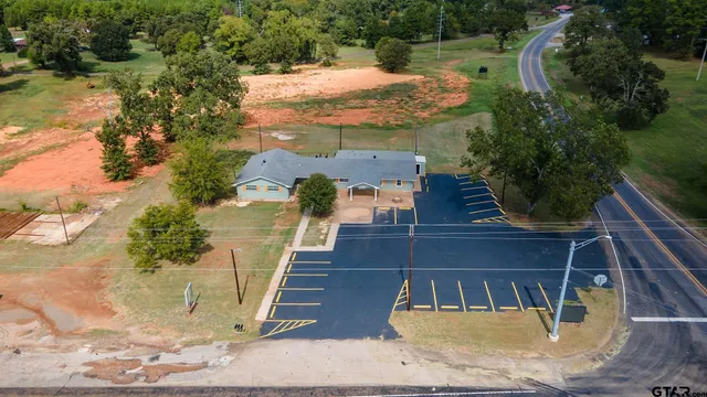 an empty room with closet and wooden floor