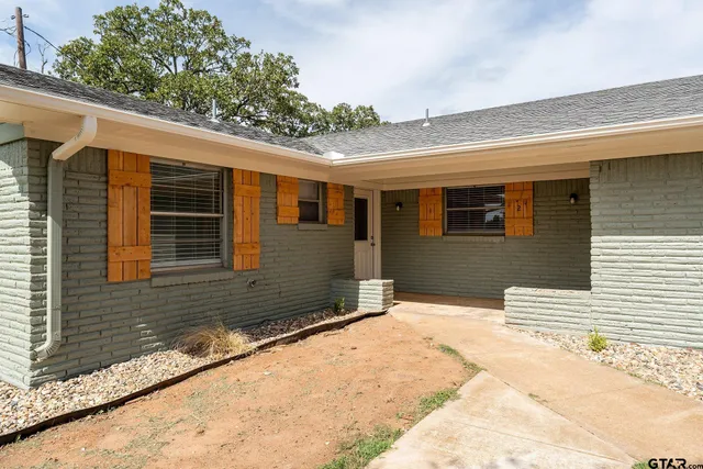 a house with trees in the background