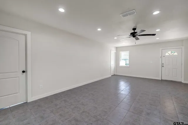 a kitchen with stainless steel appliances a refrigerator stove a sink and a refrigerator