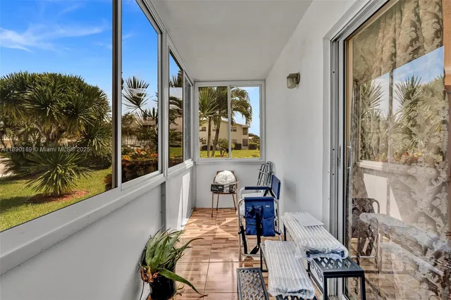 a view of balcony with furniture
