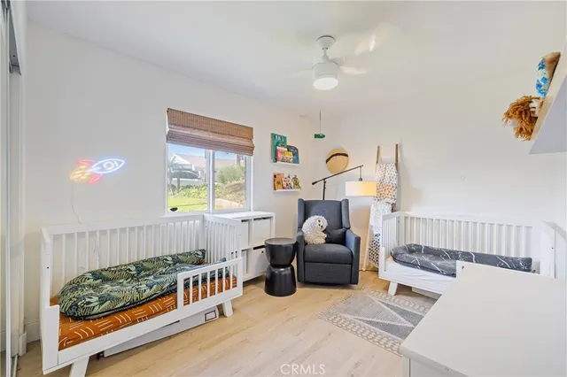 a bedroom with furniture and a window