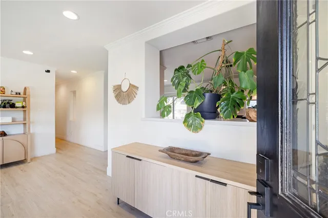 a view of kitchen with furniture and a potted plant