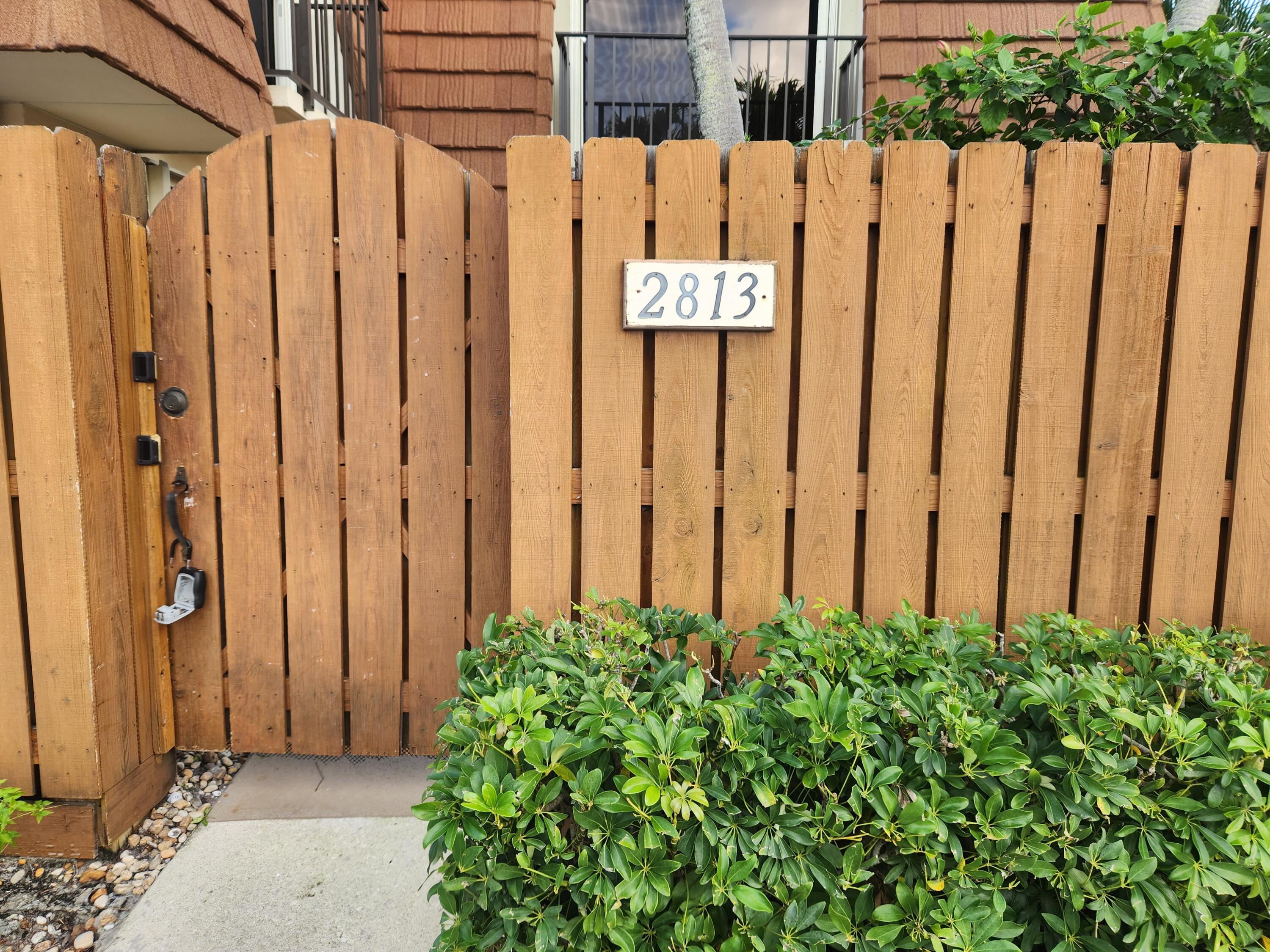 2813 28th Court Jupiter, FL 33477 - Photo 2 of 25 28th Court Front Gate Entry