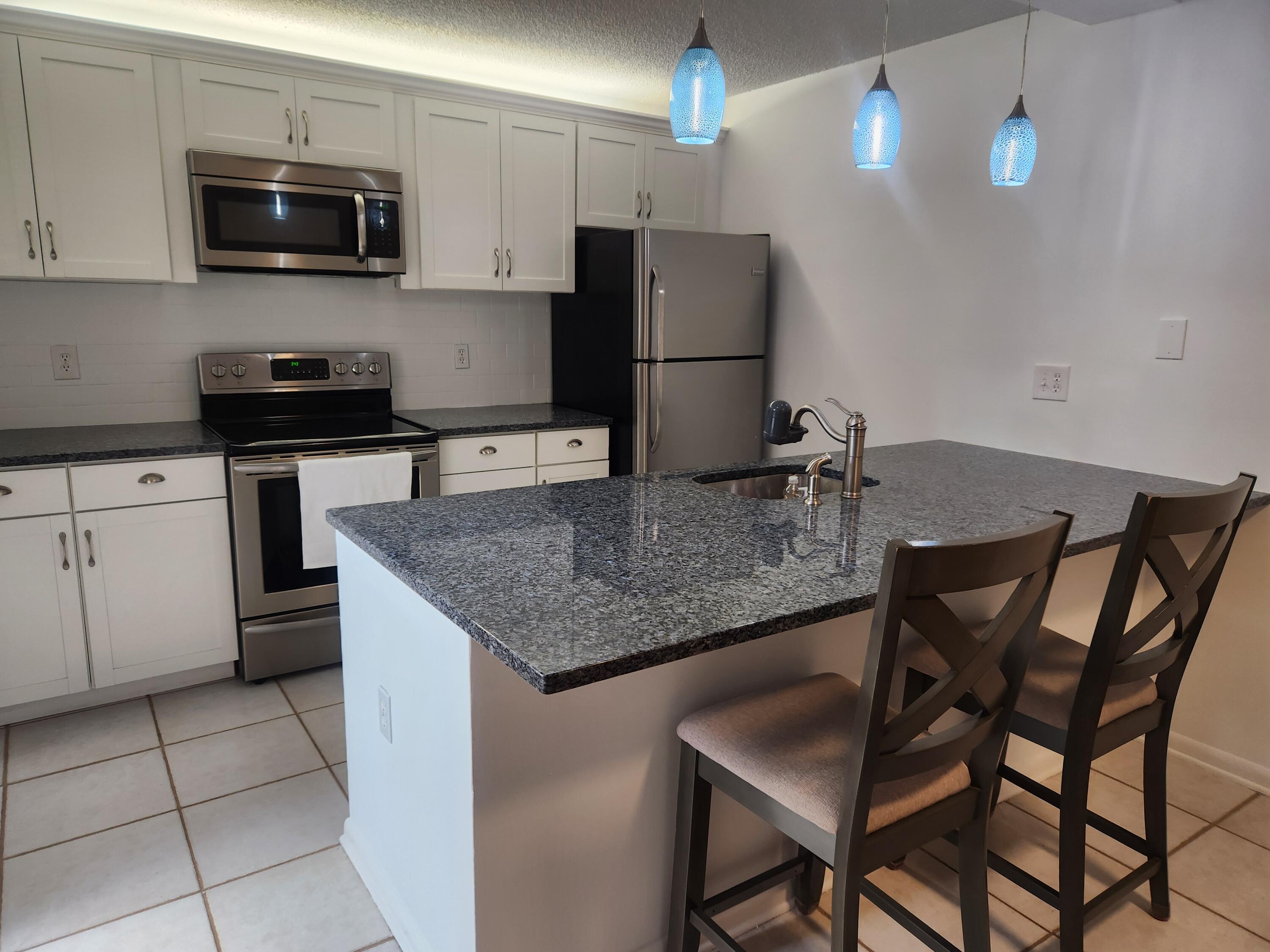 2813 28th Court Jupiter, FL 33477 - Photo 4 of 25 28th Court Kitchen 2