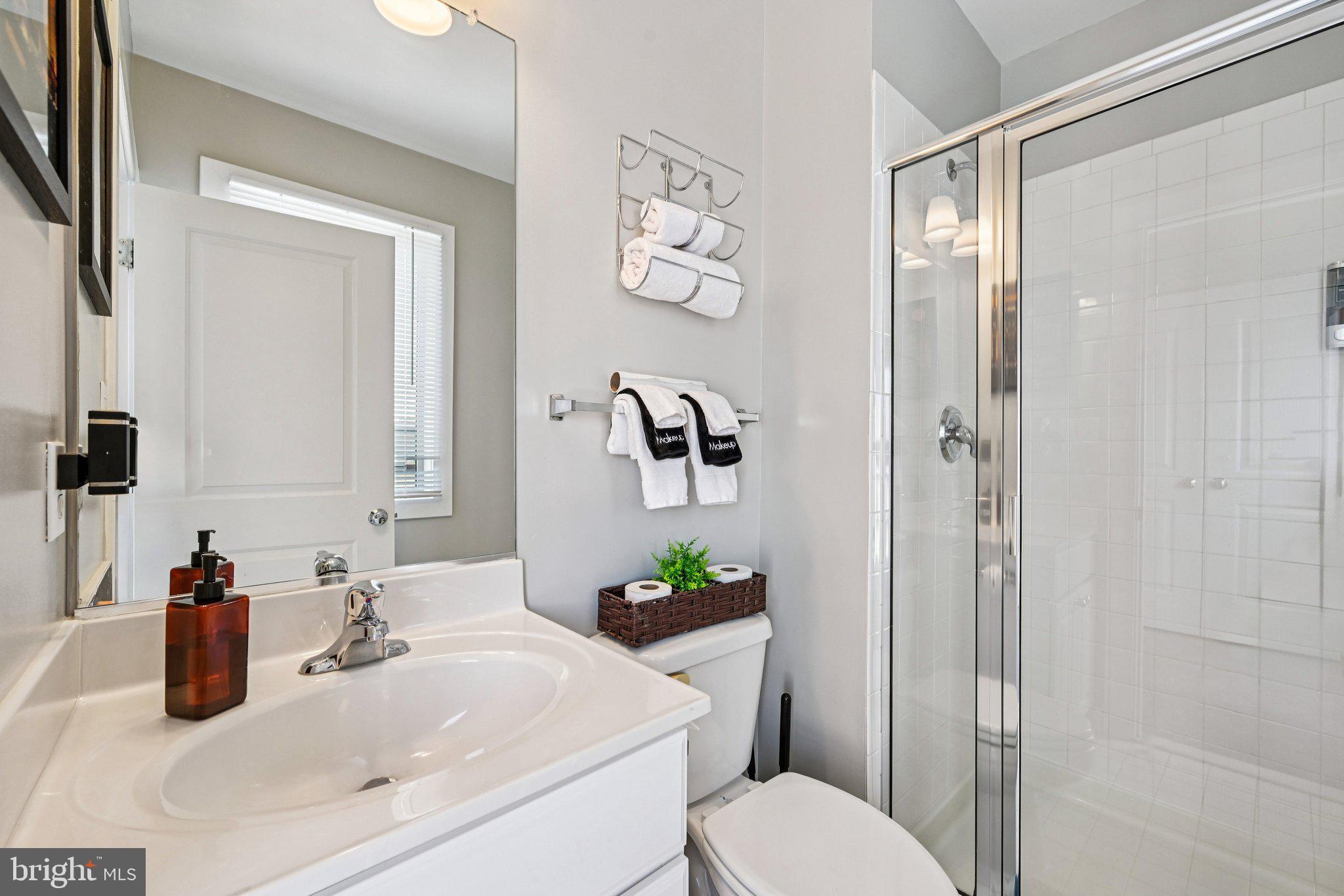24 South Regester Street Baltimore, MD 21231 - Photo 26 of 44 a bathroom with a sink vanity mirror and toilet