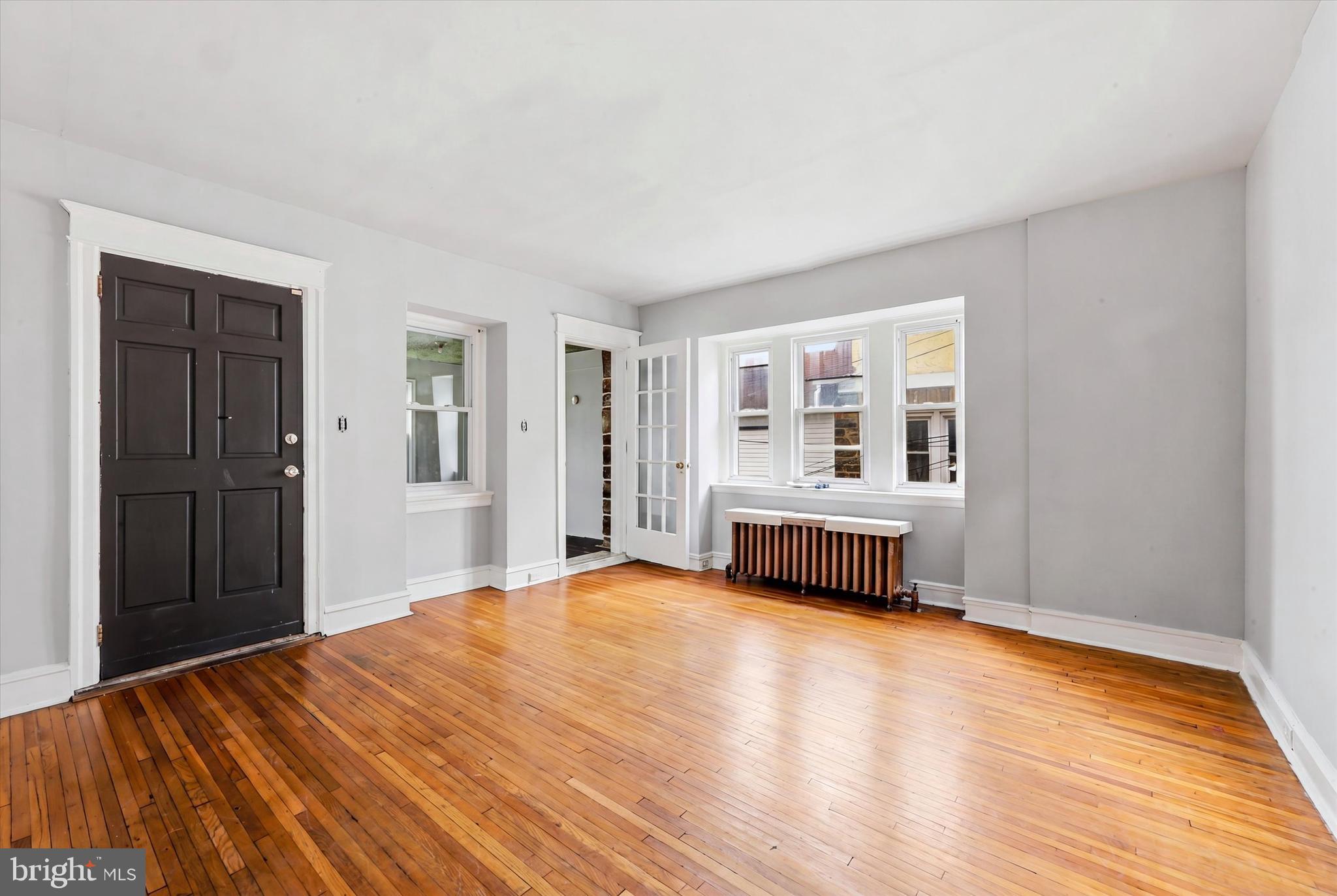 55 Richfield Road Upper Darby, PA 19082 - Photo 6 of 33 a bedroom with a bed and wooden floor
