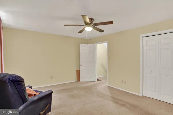 a view of room with window and ceiling fan