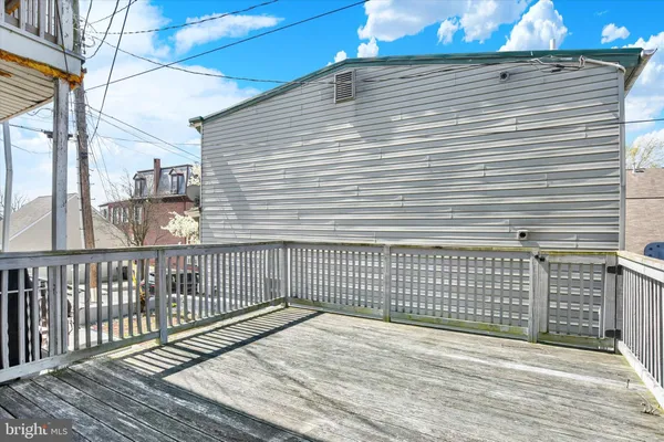 a view of a balcony with wooden floor