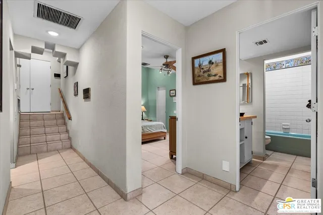 a view of a hallway view with wooden floor and staircase