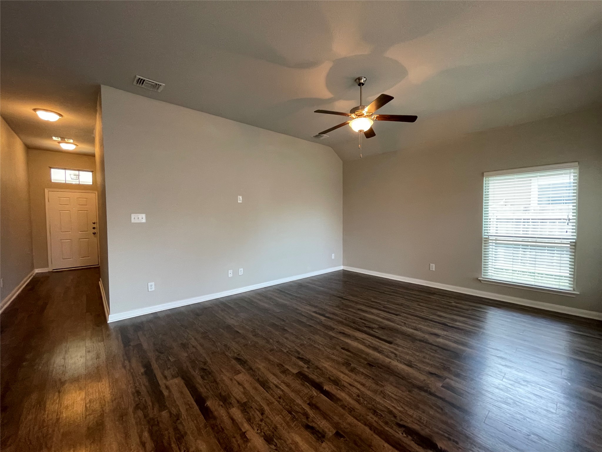 8113 Northgate Loop Temple, TX 76502 - Photo 3 of 35 Spacious room featuring wood-finish flooring, a contemporary ceiling fan, and neutral wall tones