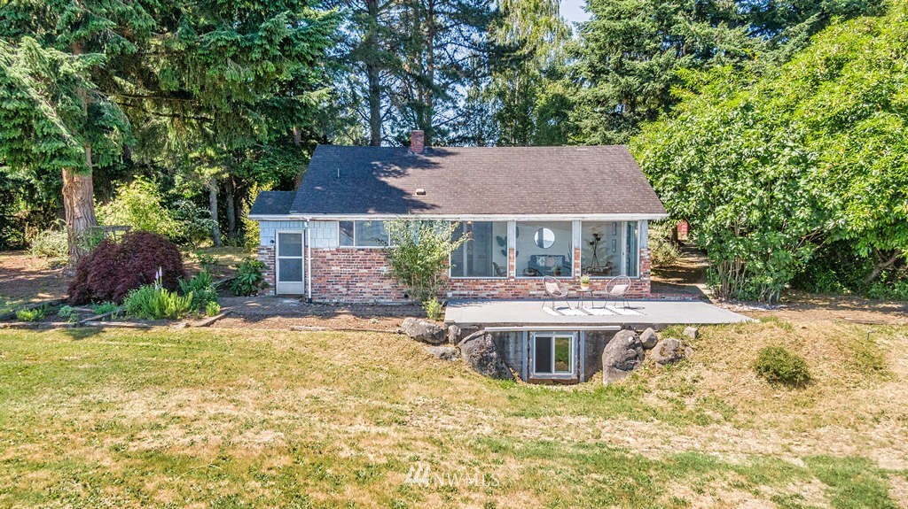 19102 Ridge Road Southwest Vashon, WA 98070 - Photo 1 of 29 a front view of a house with garden