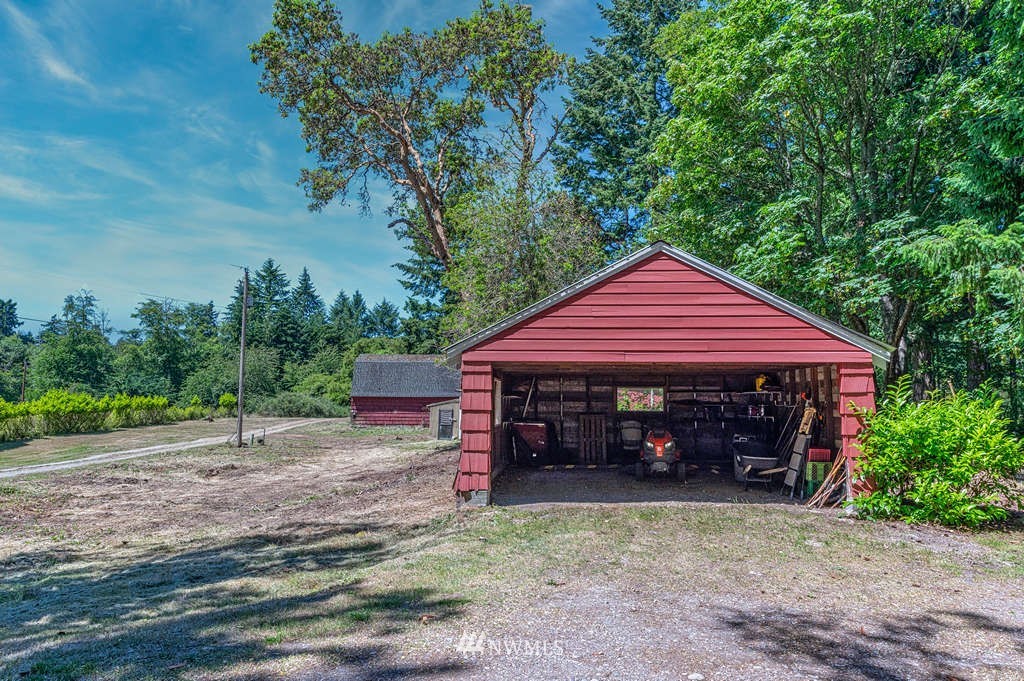 19102 Ridge Road Southwest Vashon, WA 98070 - Photo 22 of 29 a front view of a house with garden