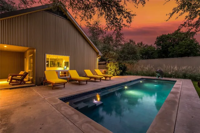 a view of swimming pool with seating space