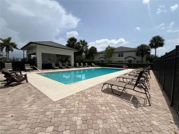 a view of a lake with houses in the back